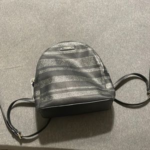 Kate spade mini backpack. Appx 10x8x4 inches. Black with silver sparkle stripes.